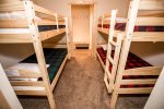 Bunk room with two twin over twin bunk beds